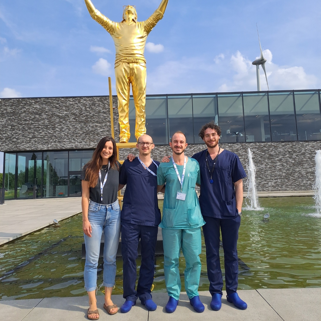 Fellows at statue at Orsi